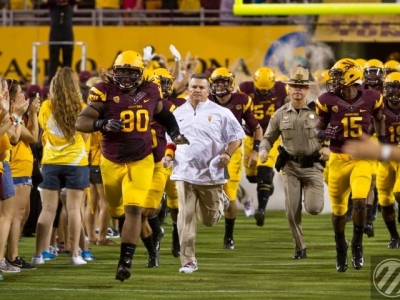 Sutton leads the Sun Devil charge onto the field.