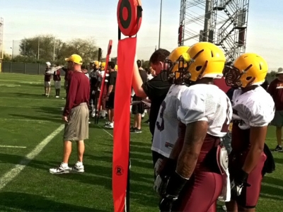 Alden Darby and teammates wait their turn at practice.