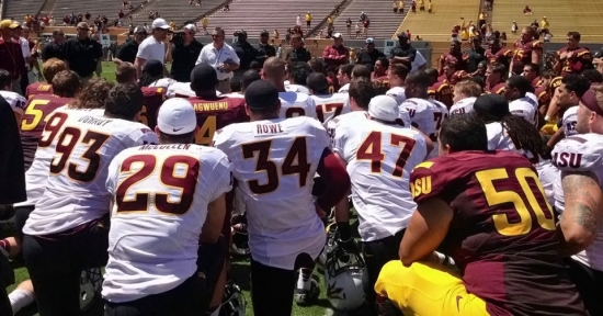 Jake Plummer talks to the team after the spring scrimmage.