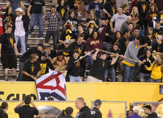 Tempe, AZ- ASU Students get their hands on the UA Flag follwing the 2011 Territorial Cup