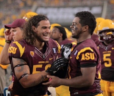 #52 Carl Bradford celebrates with #21 Chris Young following ASU's shut-out of Sacramento State