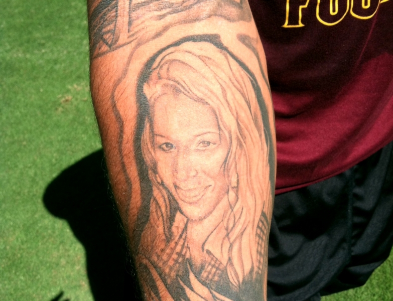 Carl Bradford displays one of most inspirational tattoos of his cousin Christina.