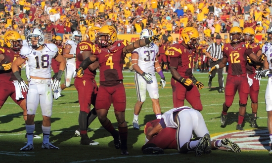 Safety #4 Alden Darby alerts the crowd of a Sun Devil fumble recovery by LB Chris Young