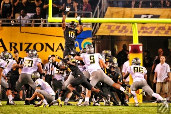 Sun Devil #10 Keelan Johnson jumping to block an Oregon Field goal 