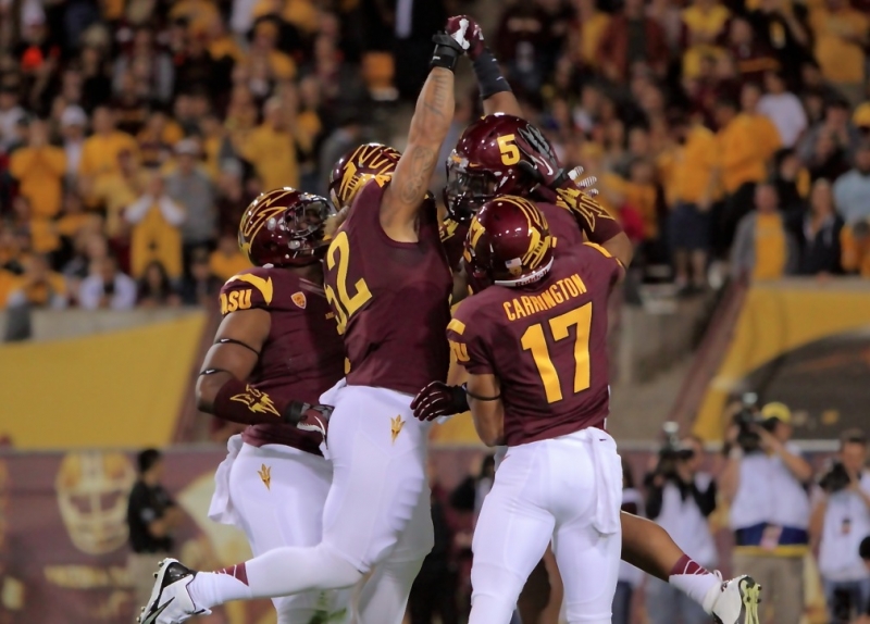 Carl Bradford, Chris Young and teammates celebrate an Oregon St. Three & Out 