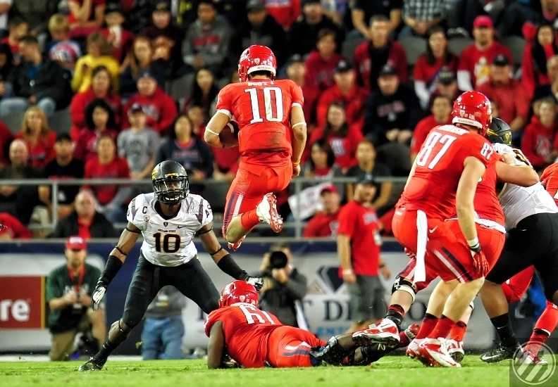 2012 Territorial Cup: In the next moment, Sun Devil #10 Kyle Johnson wraps up UA QB Matt Scott then strip the ball away for a critical turnover and arguably the most important play in ASU's 41-34 Victory