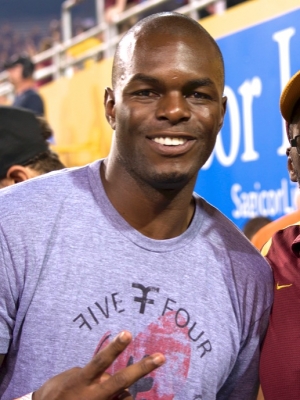 Football Alum, Derek Hagan, on the sidelines of Frank Kush Field