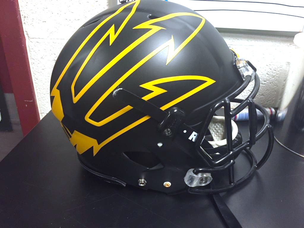 Blackout matte helmets with oversized gold pitchfork